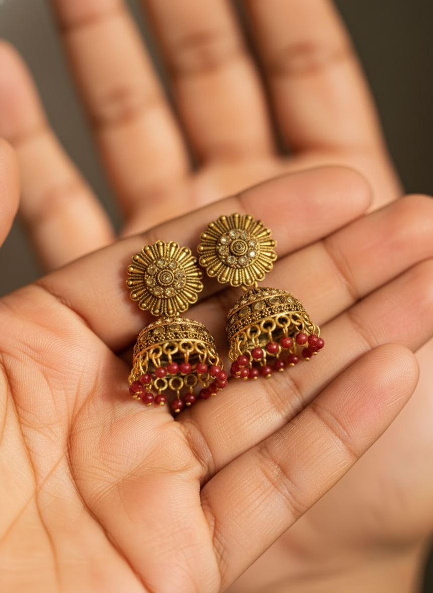 Eluria Antique Gold Floral Jhumka Earrings