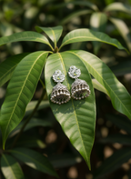 Eluria Oxidized Silver Green Stone Jhumka Earrings