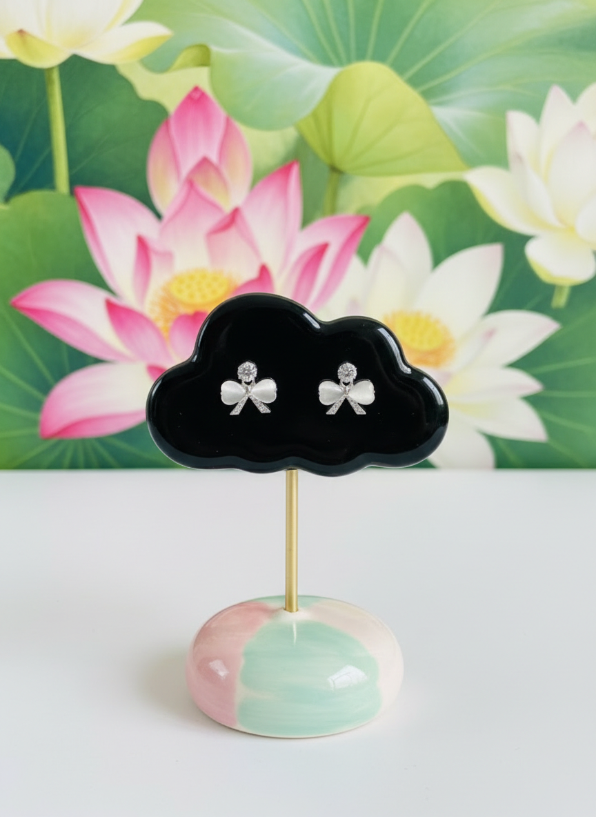 Eluria Silver Bow Pearl Stud Earrings